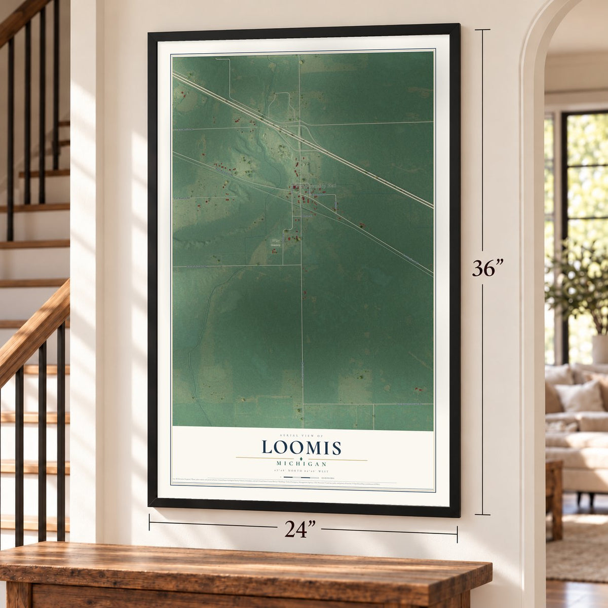 Loomis, Michigan map, 24 x 36 inch print in a black frame by a staircase