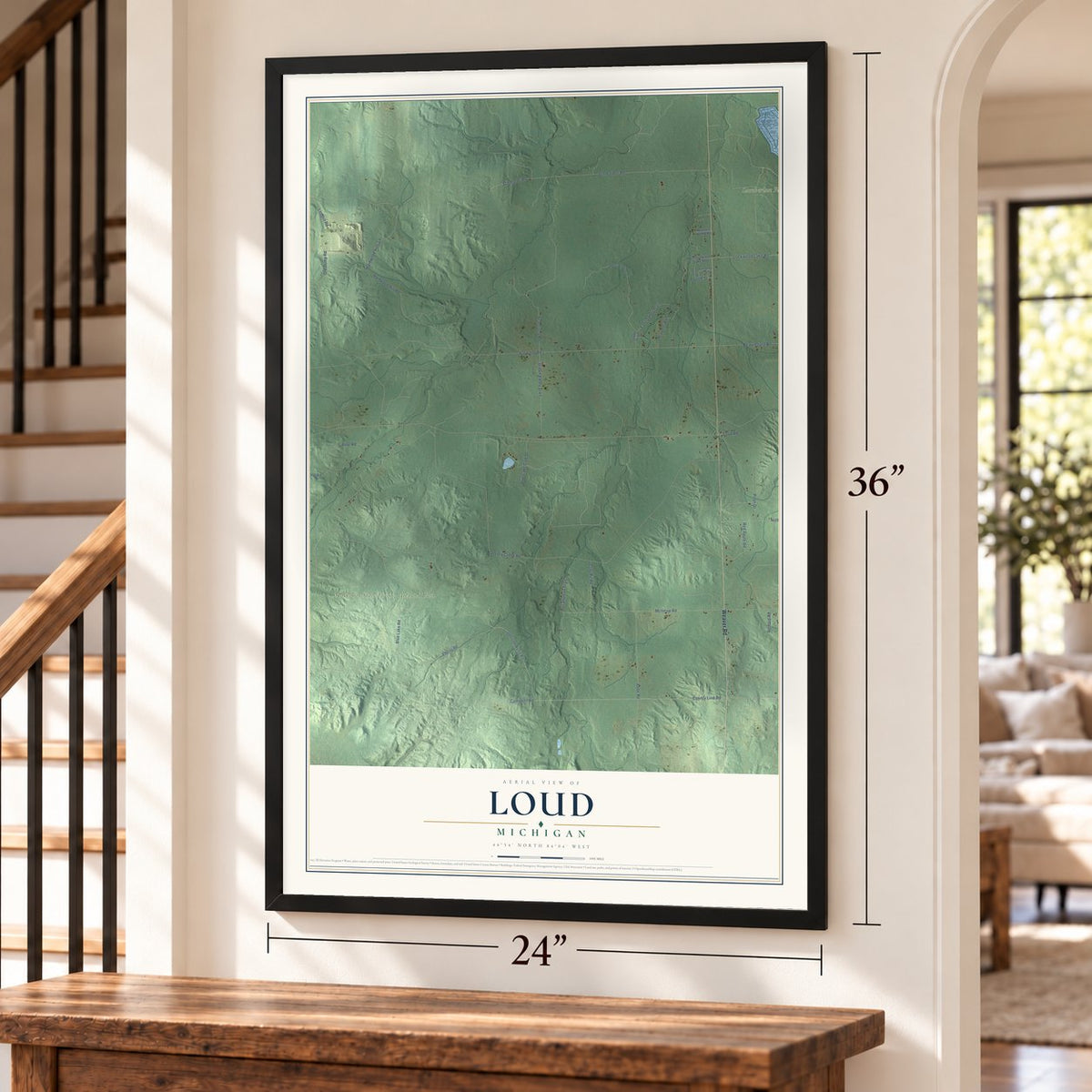 Loud, Michigan map, 24 x 36 inch print in a black frame by a staircase