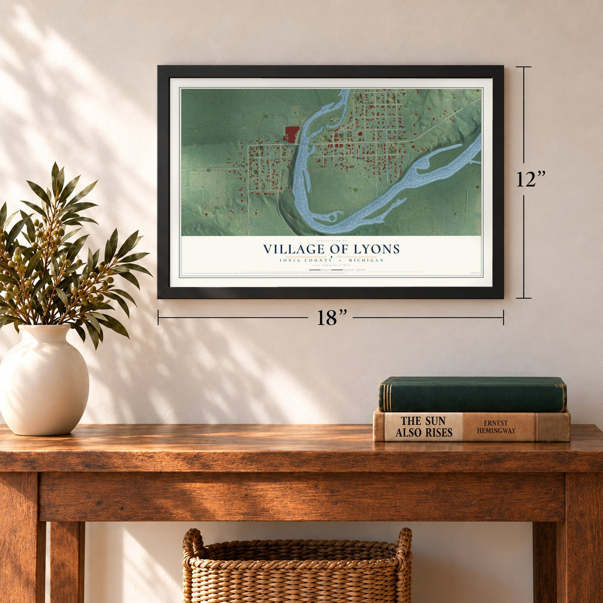 Lyons, Michigan map, 12 x 18 inch print in a black frame in an entryway