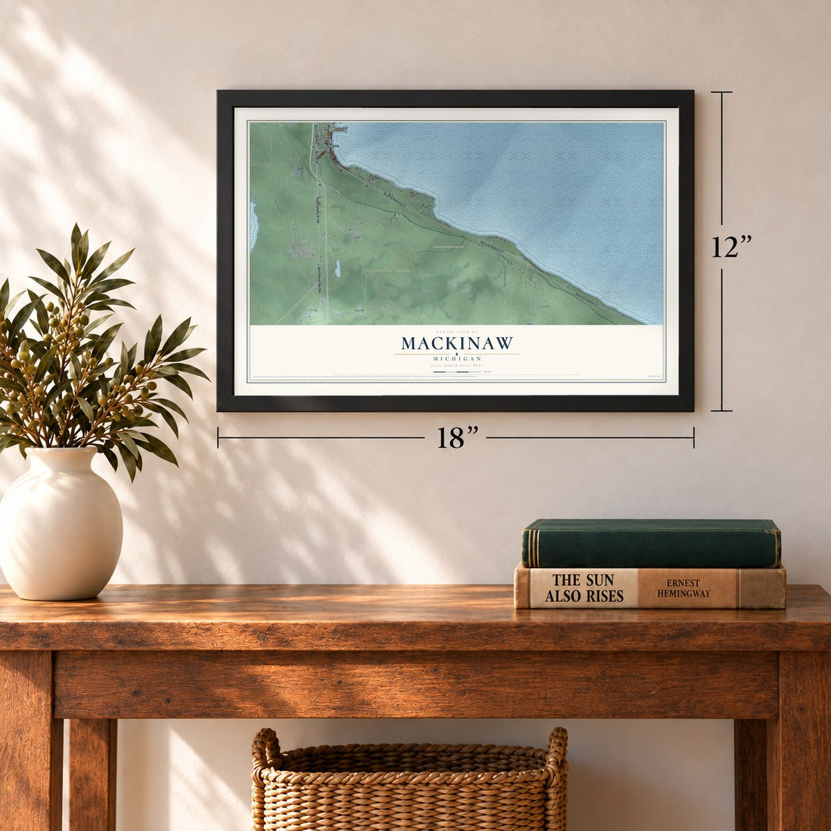 Mackinaw, Michigan map, 12 x 18 inch print in a black frame in an entryway