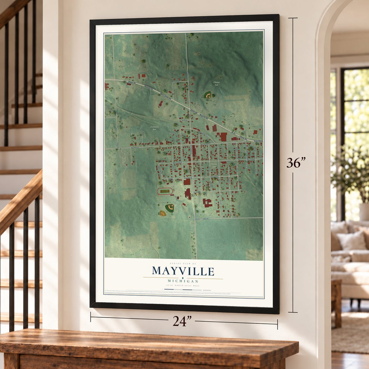 Mayville, Michigan map, 24 x 36 inch print in a black frame by a staircase
