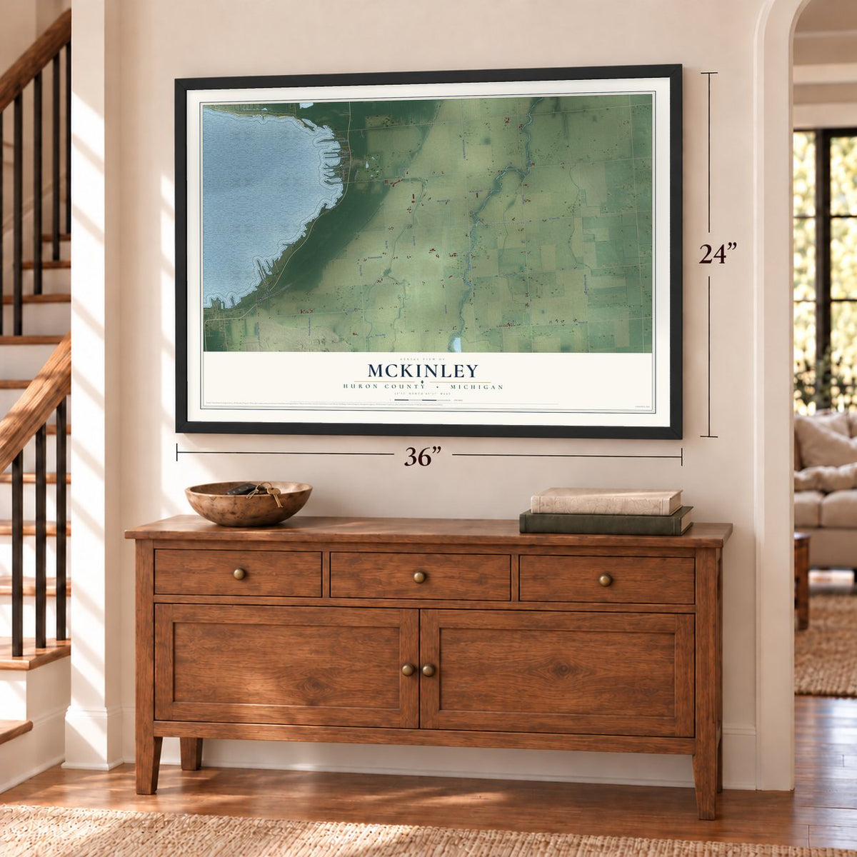 McKinley, Huron County, Michigan map, 24 x 36 inch print in a black frame above a dresser by a staircase
