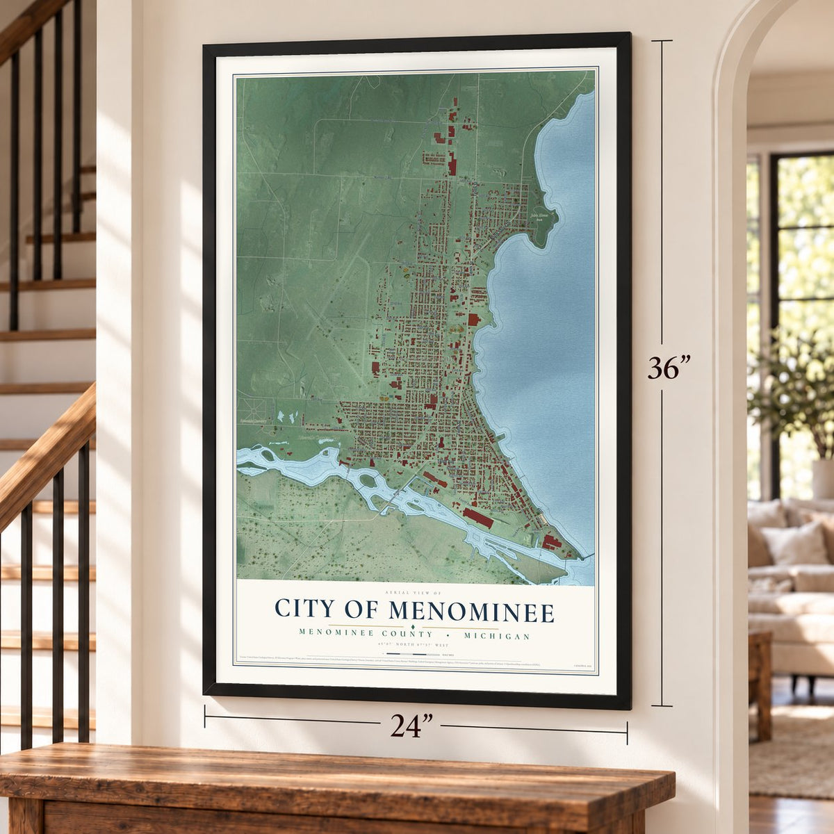 Menominee, Michigan map, 24 x 36 inch print in a black frame by a staircase