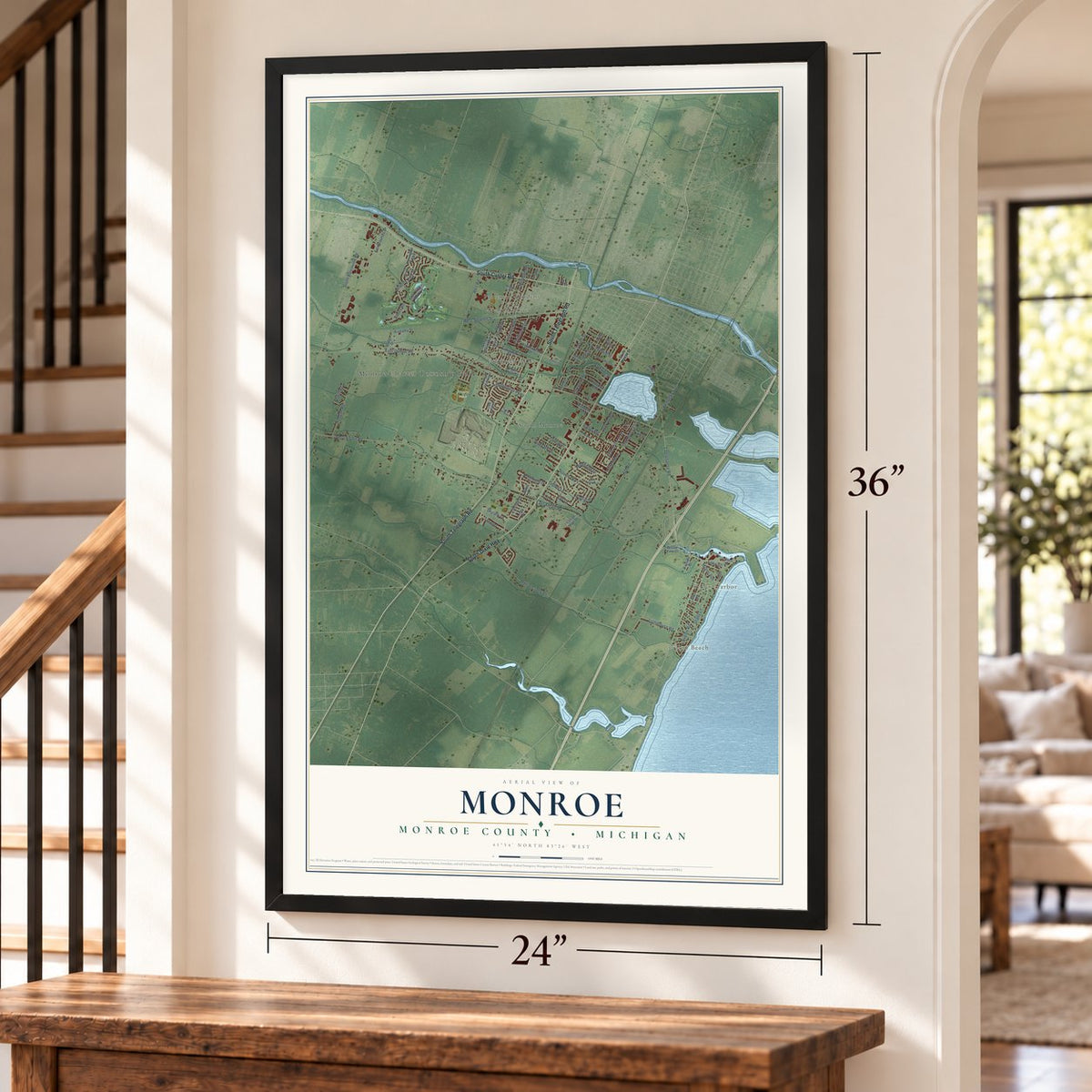 Monroe, Monroe County, Michigan map, 24 x 36 inch print in a black frame by a staircase