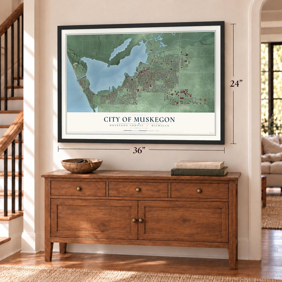 Muskegon, Michigan map, 24 x 36 inch print in a black frame above a dresser by a staircase
