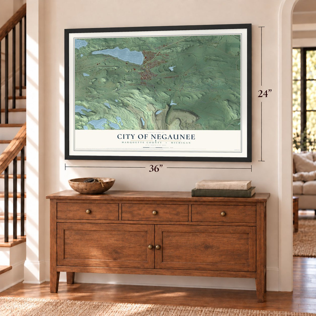 Negaunee, Michigan map, 24 x 36 inch print in a black frame above a dresser by a staircase