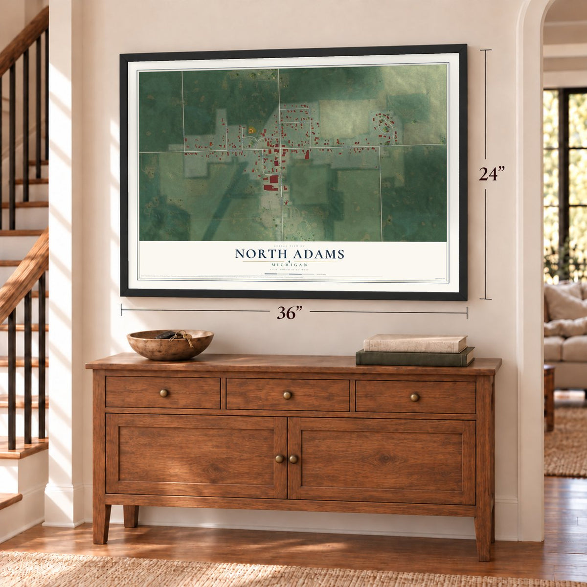 North Adams, Michigan map, 24 x 36 inch print in a black frame above a dresser by a staircase