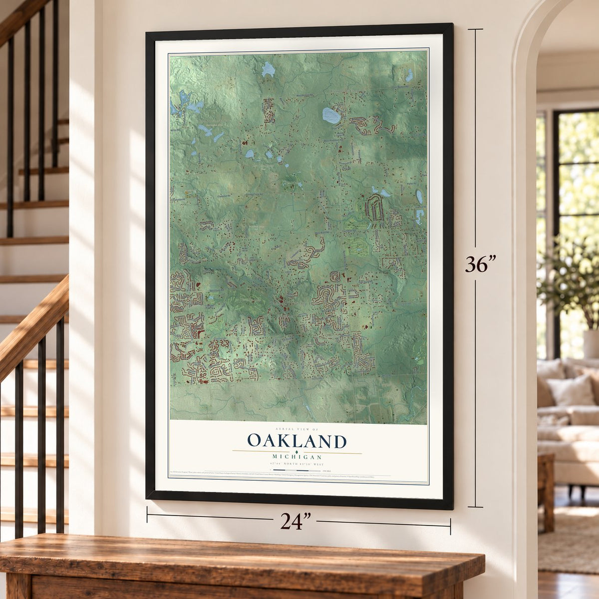 Oakland, Michigan map, 24 x 36 inch print in a black frame by a staircase