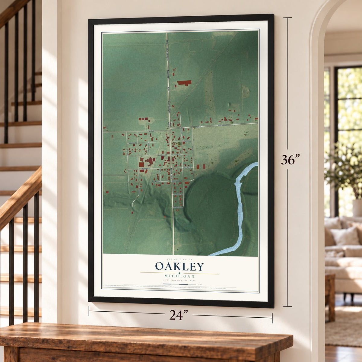 Oakley, Michigan map, 24 x 36 inch print in a black frame by a staircase