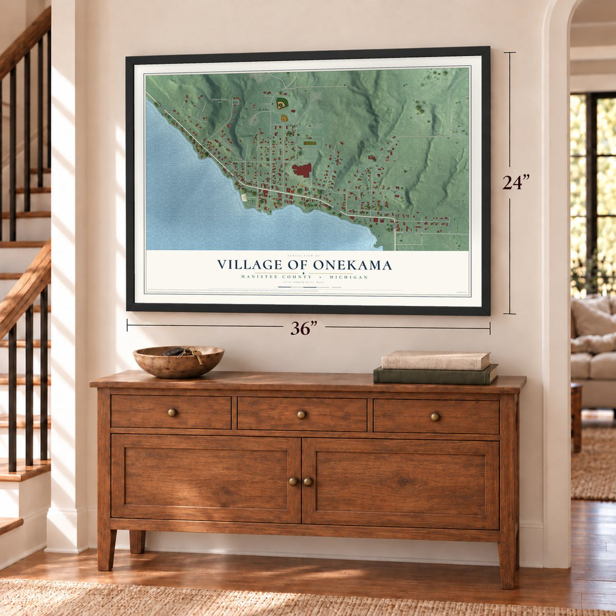 Onekama, Michigan map, 24 x 36 inch print in a black frame above a dresser by a staircase