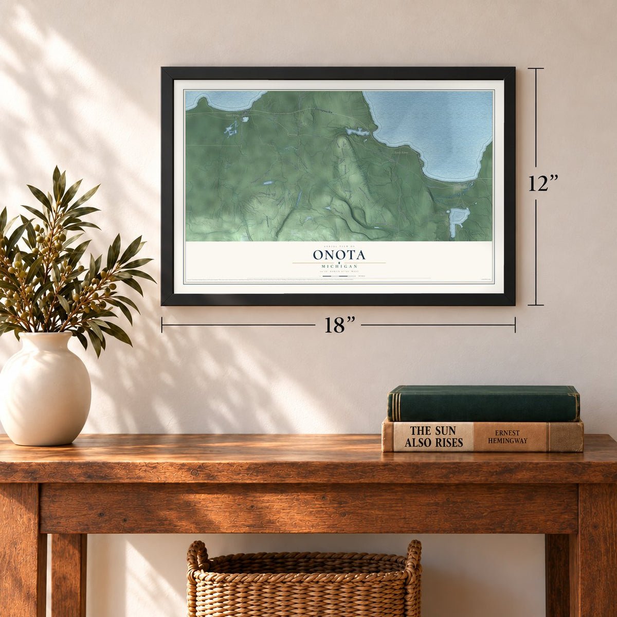 Onota, Michigan map, 12 x 18 inch print in a black frame in an entryway