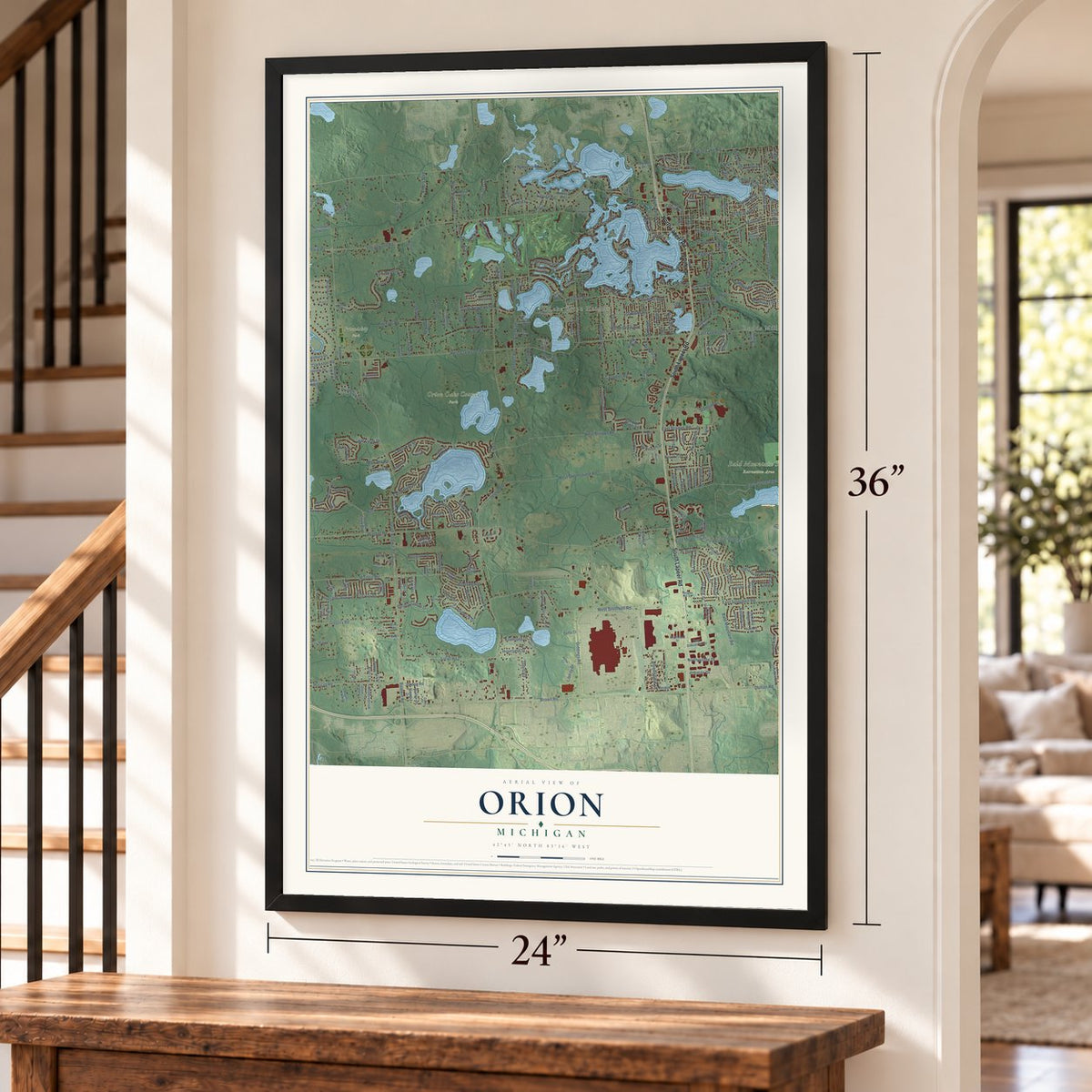 Orion, Michigan map, 24 x 36 inch print in a black frame by a staircase