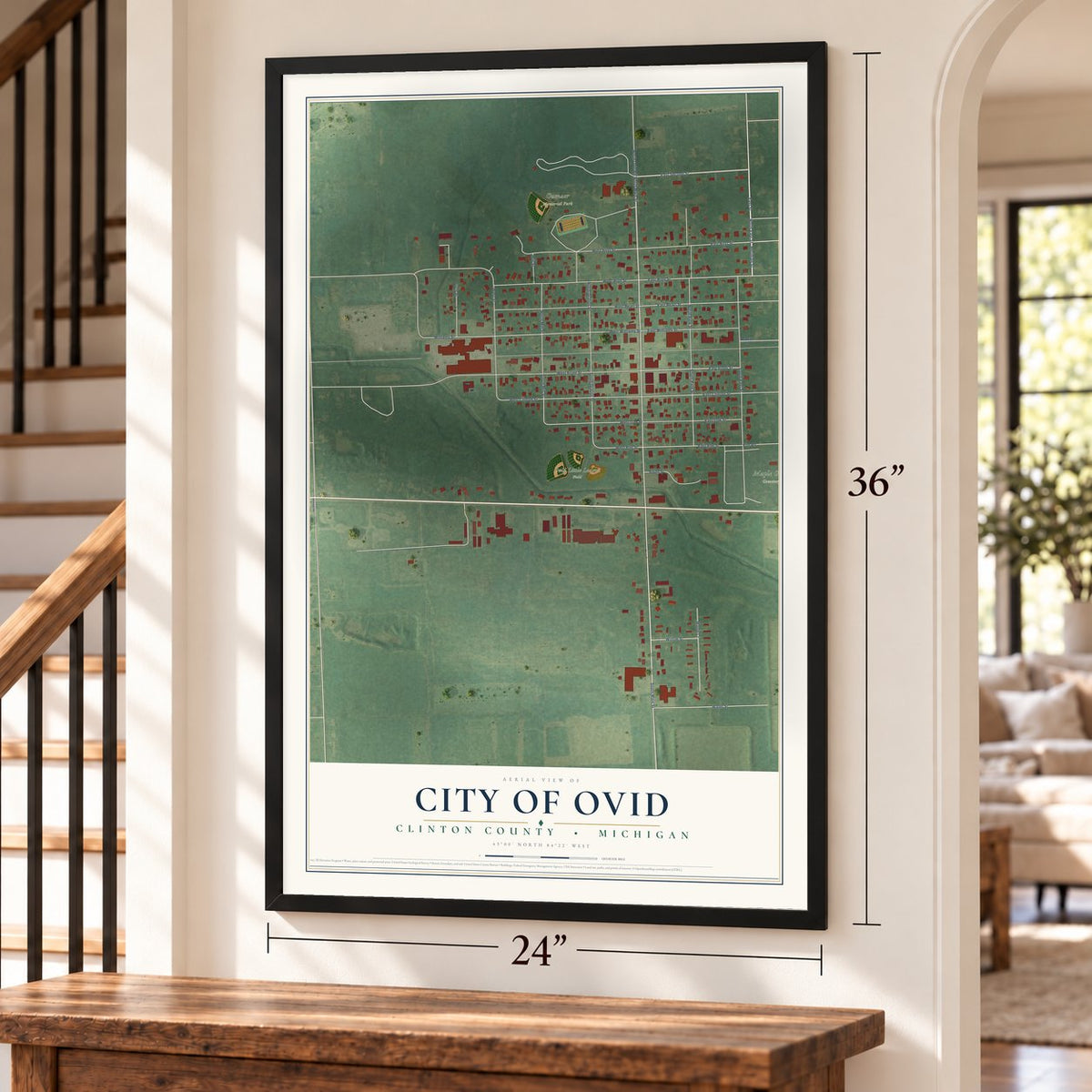 Ovid, Michigan map, 24 x 36 inch print in a black frame by a staircase
