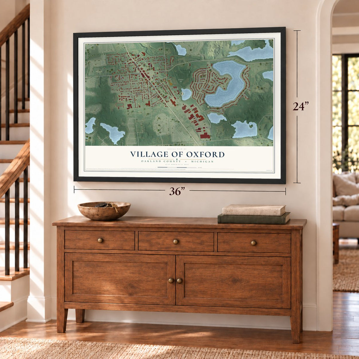 Oxford, Michigan map, 24 x 36 inch print in a black frame above a dresser by a staircase