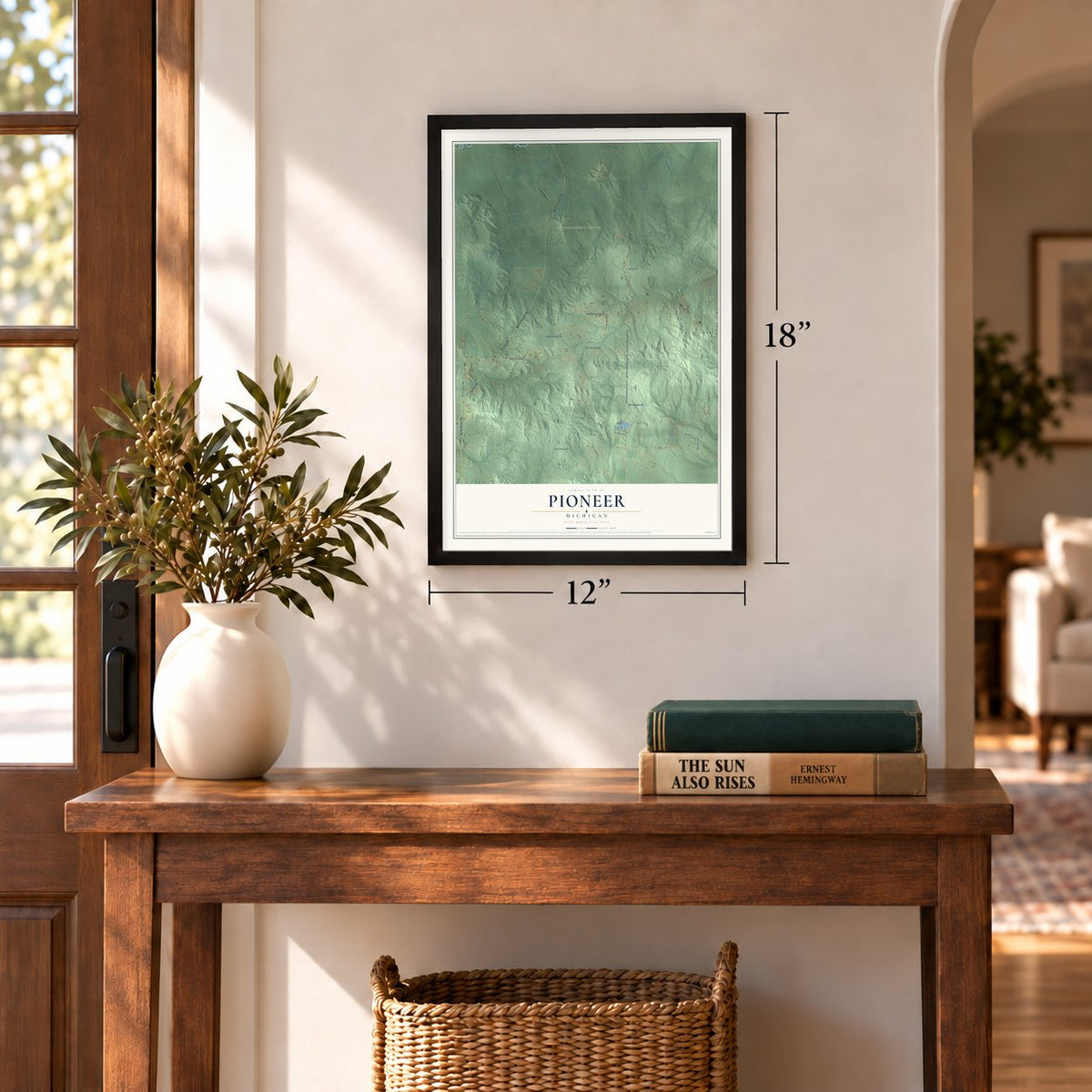 Pioneer, Michigan map, 12 x 18 inch print in a black frame in an entryway