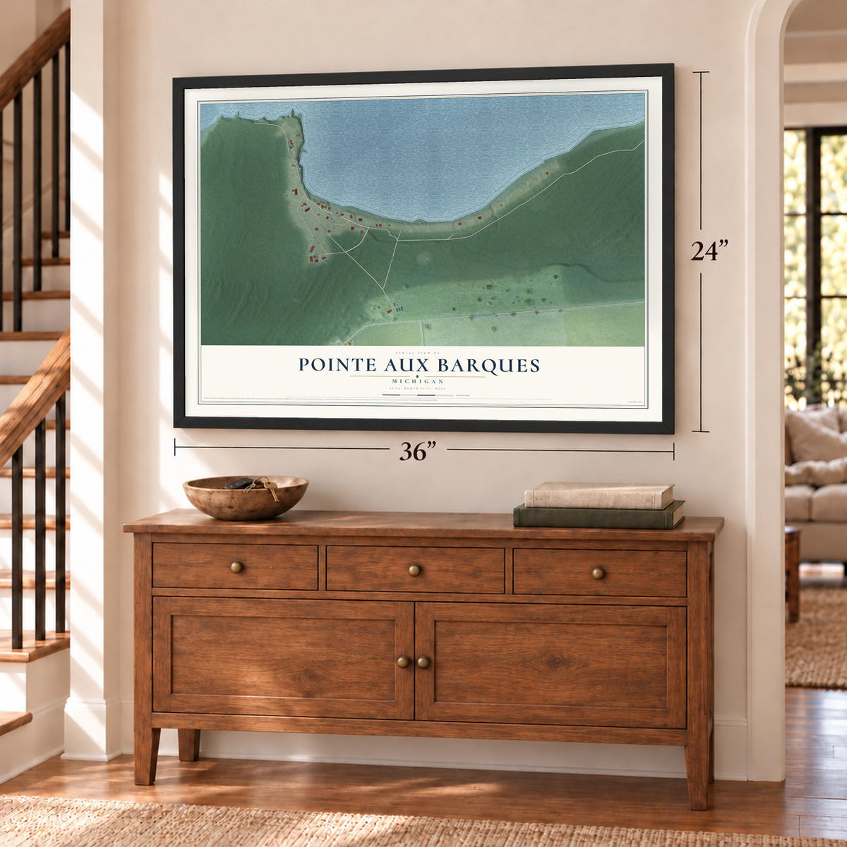 Pointe Aux Barques, Michigan map, 24 x 36 inch print in a black frame above a dresser by a staircase