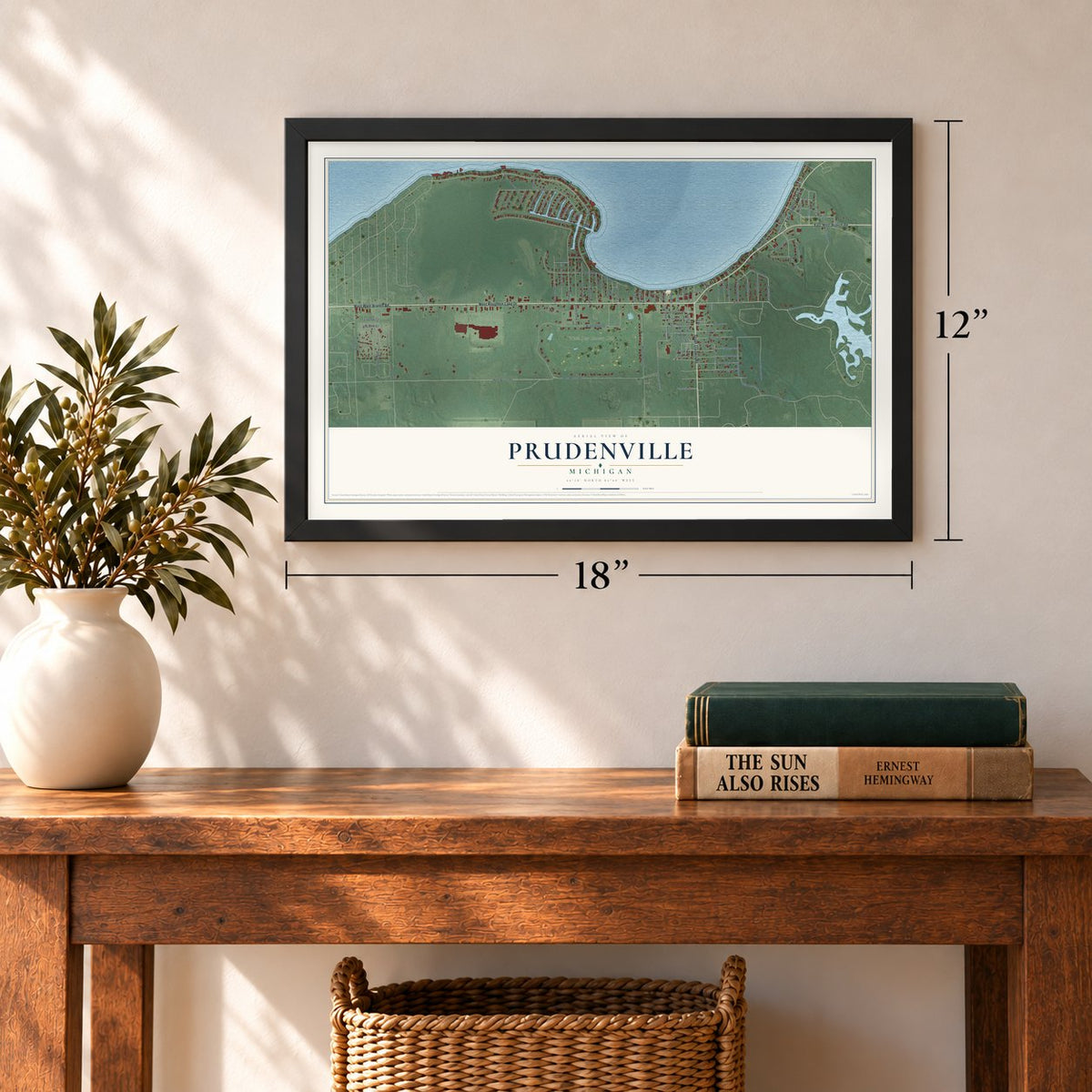 Prudenville, Michigan map, 12 x 18 inch print in a black frame in an entryway