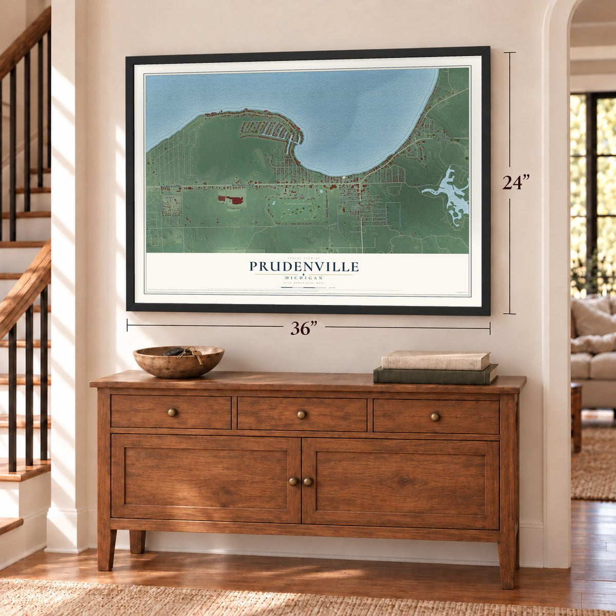 Prudenville, Michigan map, 24 x 36 inch print in a black frame above a dresser by a staircase