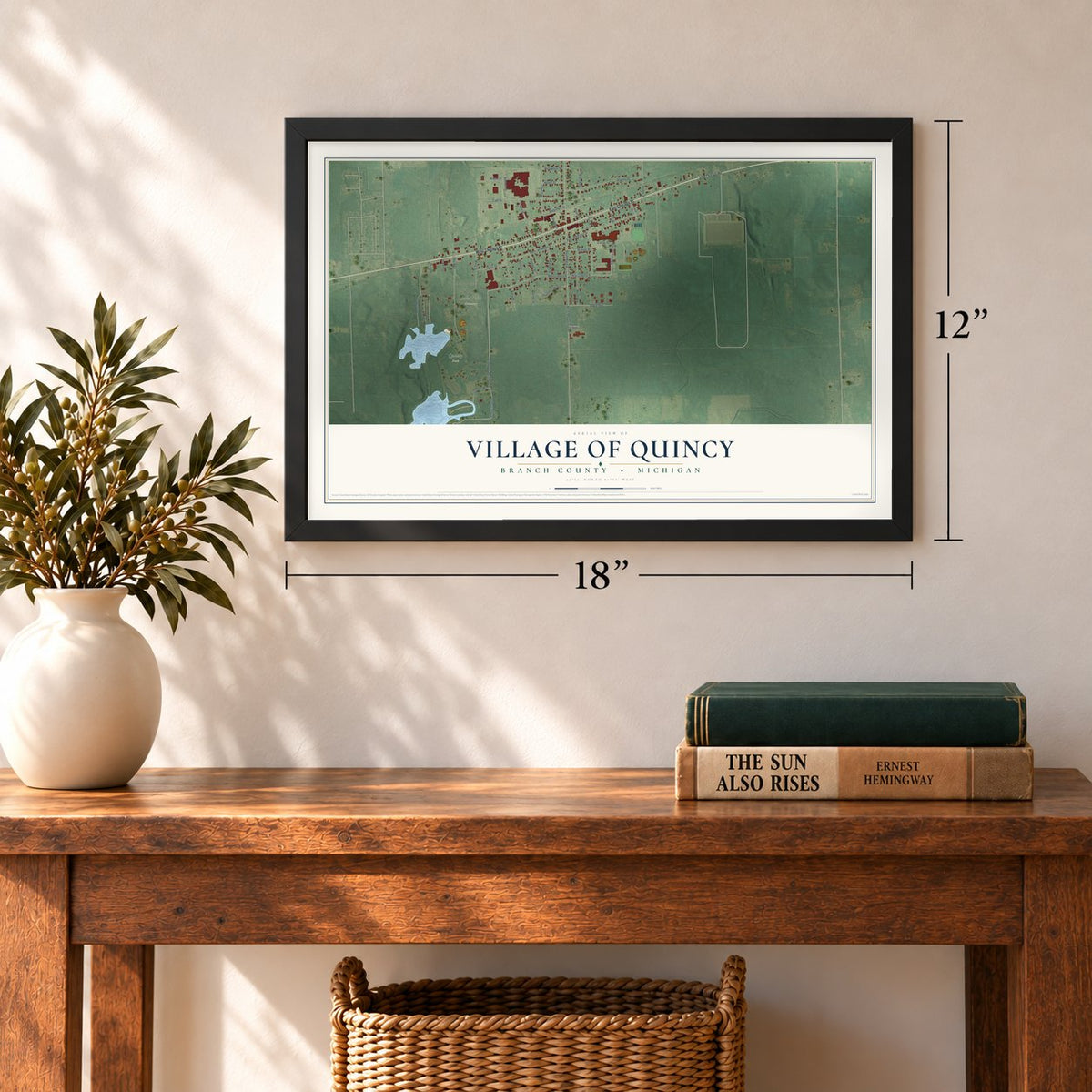 Quincy, Michigan map, 12 x 18 inch print in a black frame in an entryway
