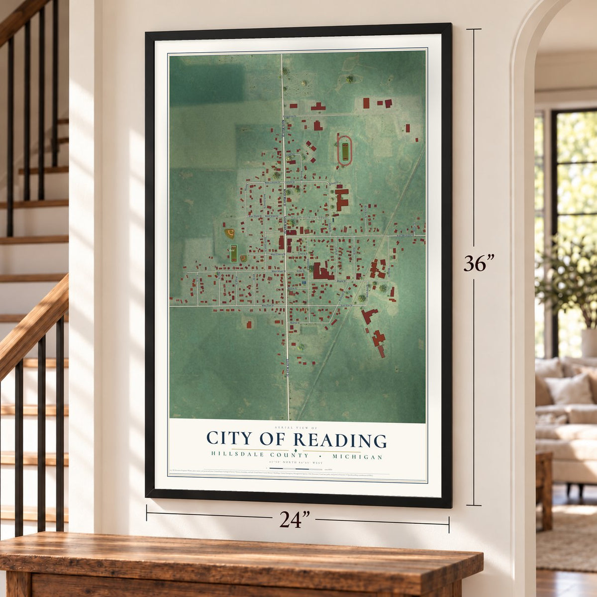 Reading, Michigan map, 24 x 36 inch print in a black frame by a staircase