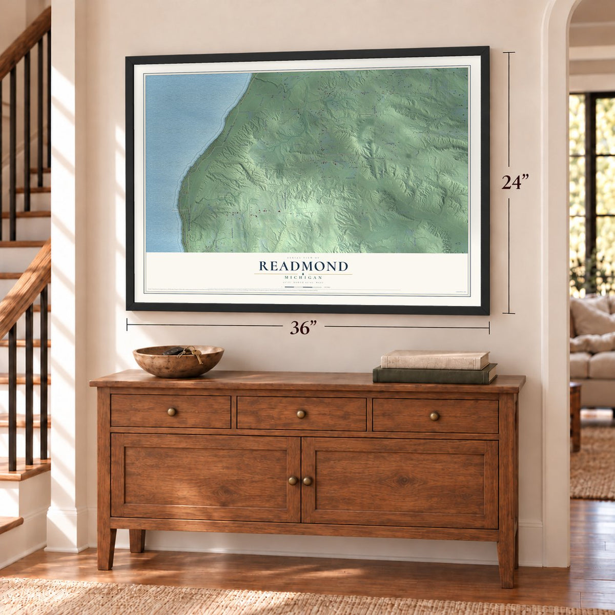 Readmond, Michigan map, 24 x 36 inch print in a black frame above a dresser by a staircase