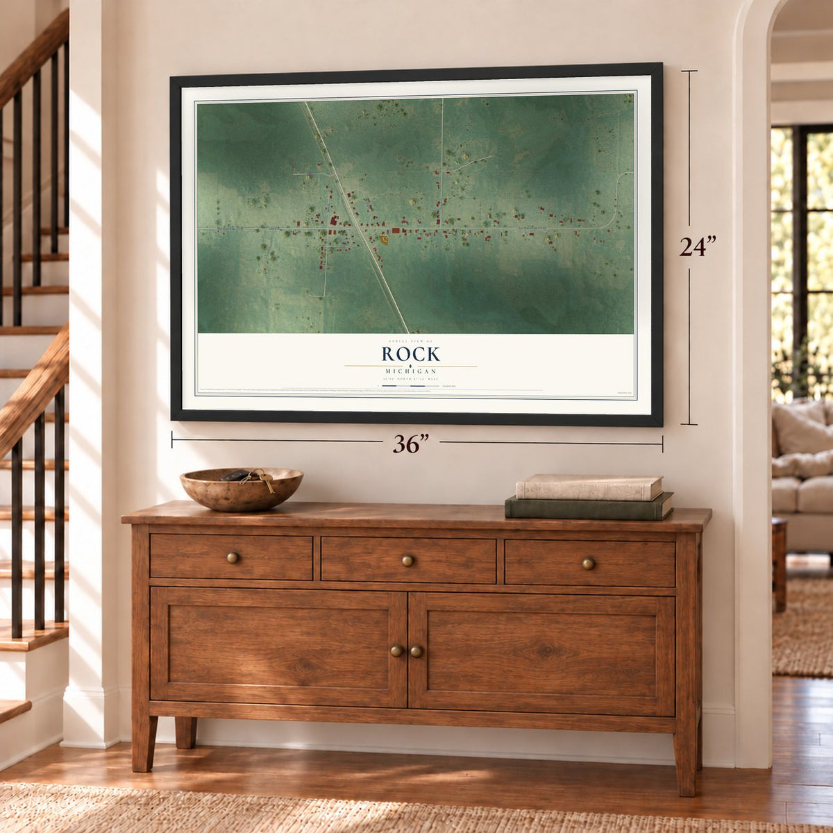Rock, Michigan map, 24 x 36 inch print in a black frame above a dresser by a staircase