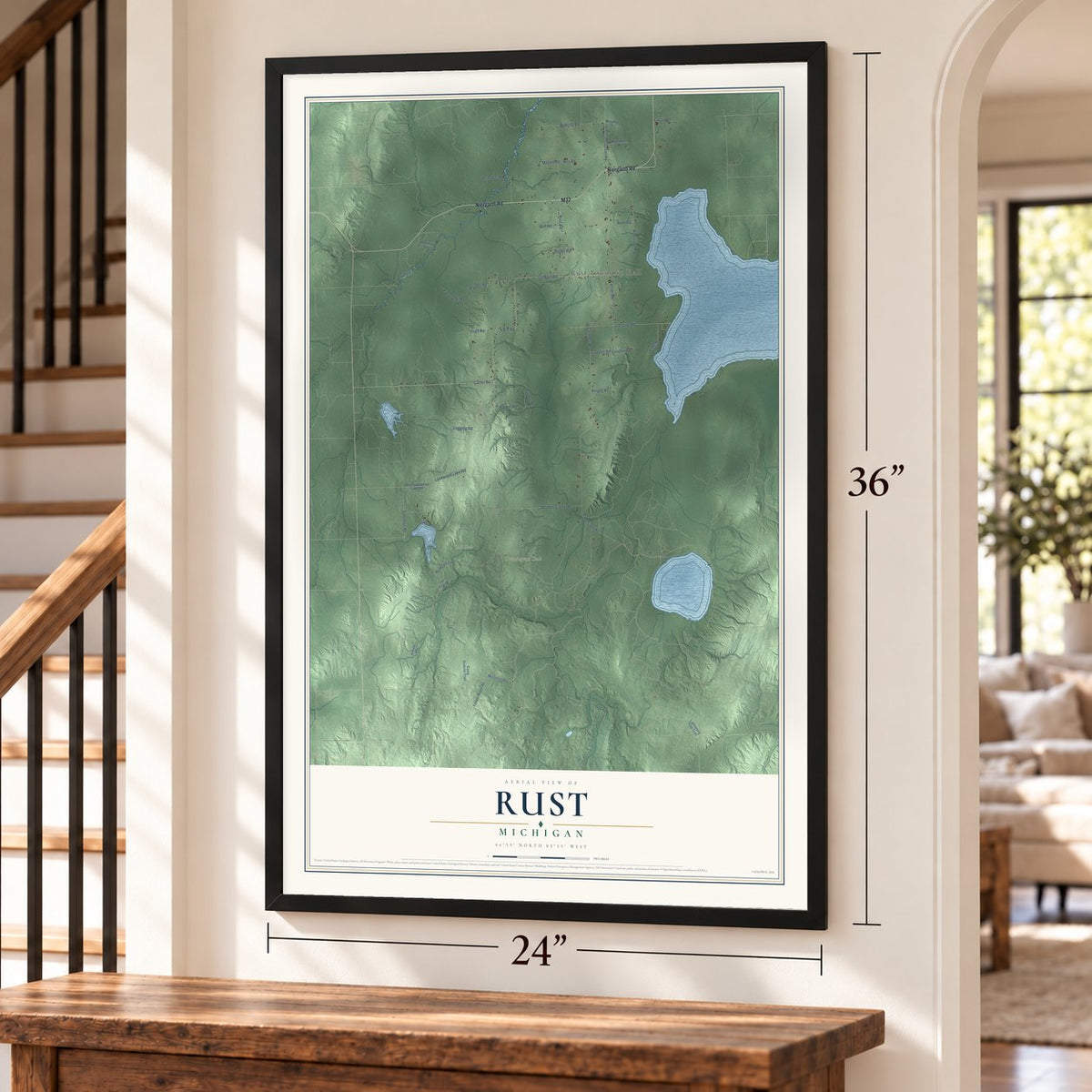 Rust, Michigan map, 24 x 36 inch print in a black frame by a staircase