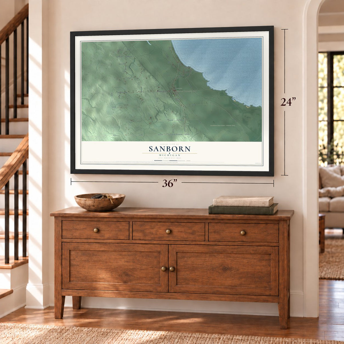 Sanborn, Michigan map, 24 x 36 inch print in a black frame above a dresser by a staircase