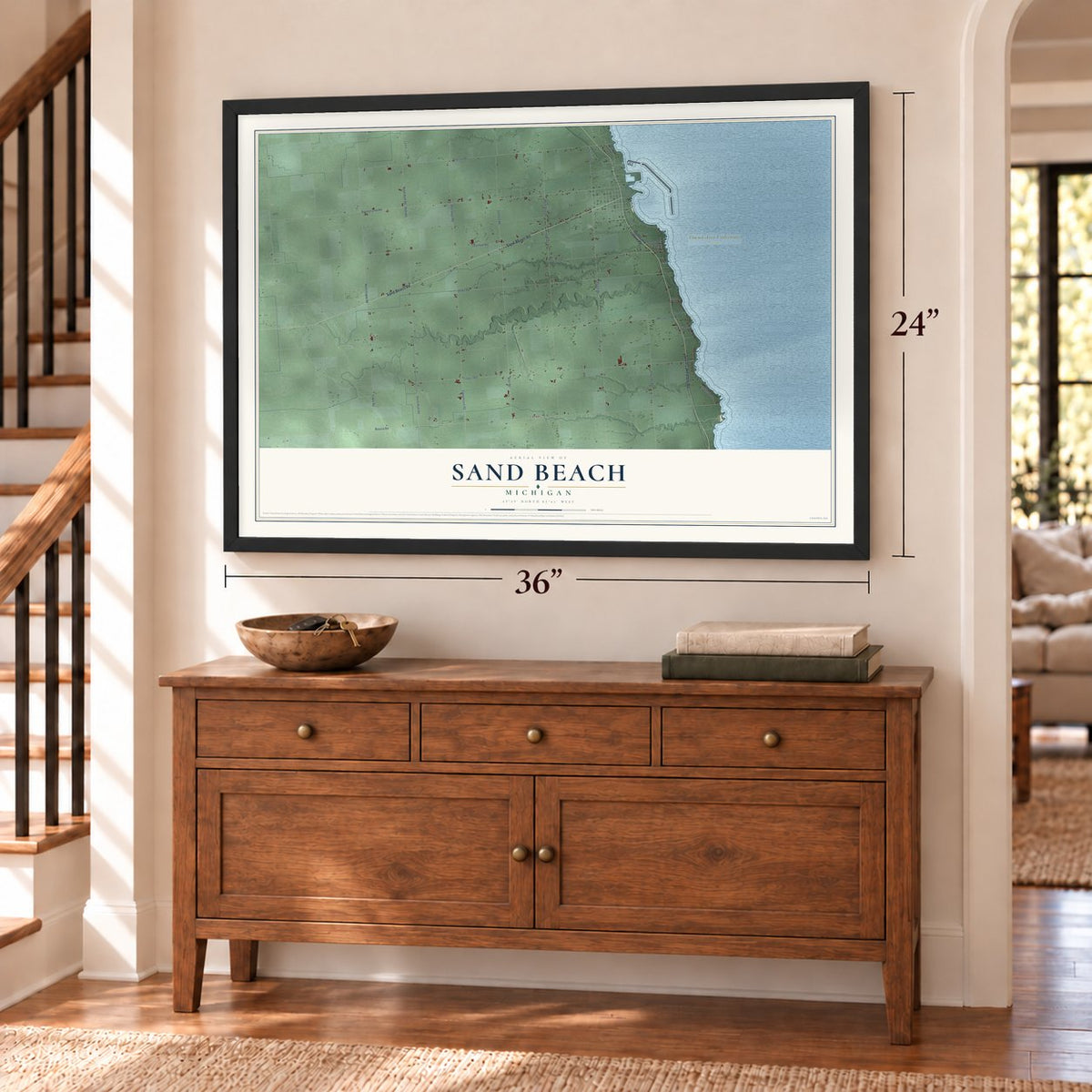 Sand Beach, Michigan map, 24 x 36 inch print in a black frame above a dresser by a staircase