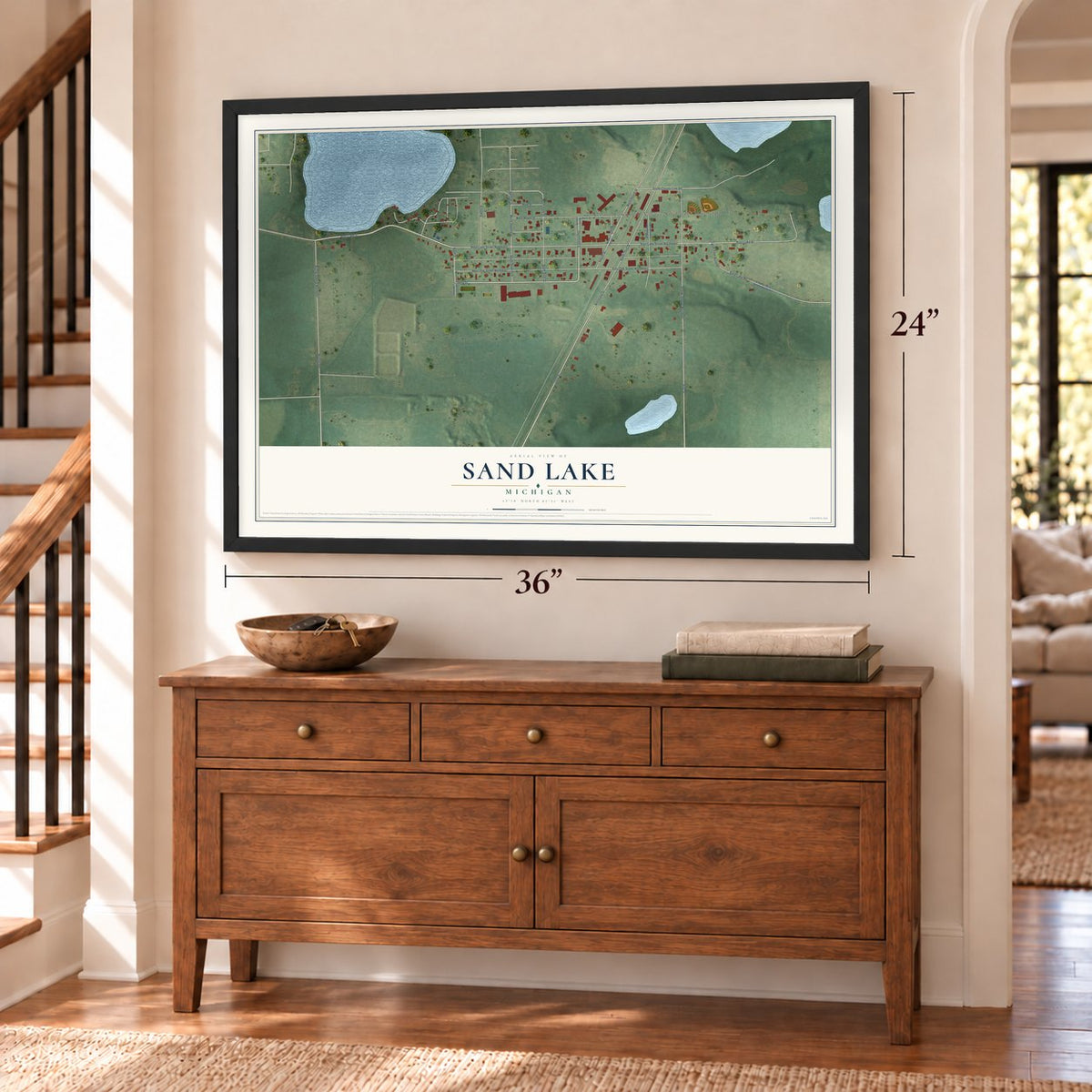 Sand Lake, Michigan map, 24 x 36 inch print in a black frame above a dresser by a staircase