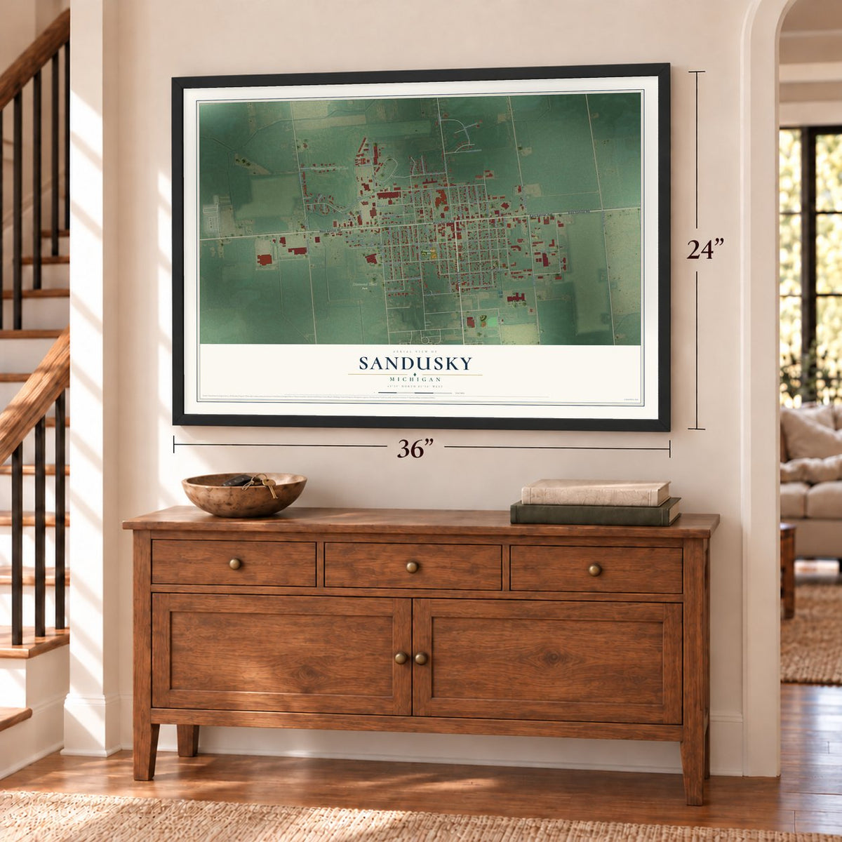 Sandusky, Michigan map, 24 x 36 inch print in a black frame above a dresser by a staircase