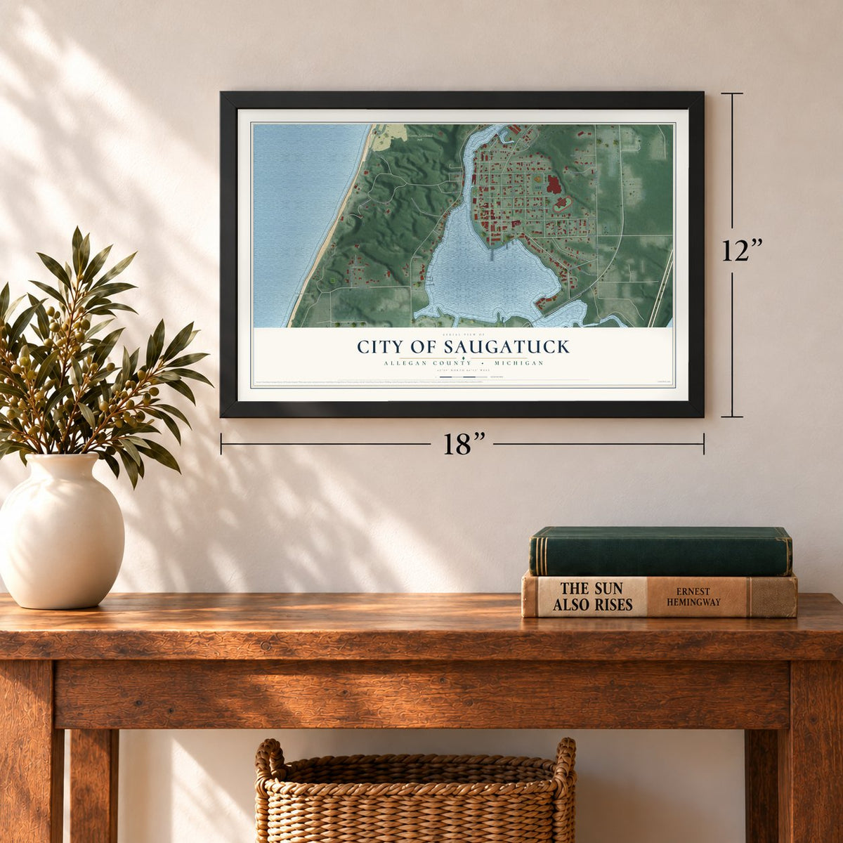 Saugatuck, Michigan map, 12 x 18 inch print in a black frame in an entryway
