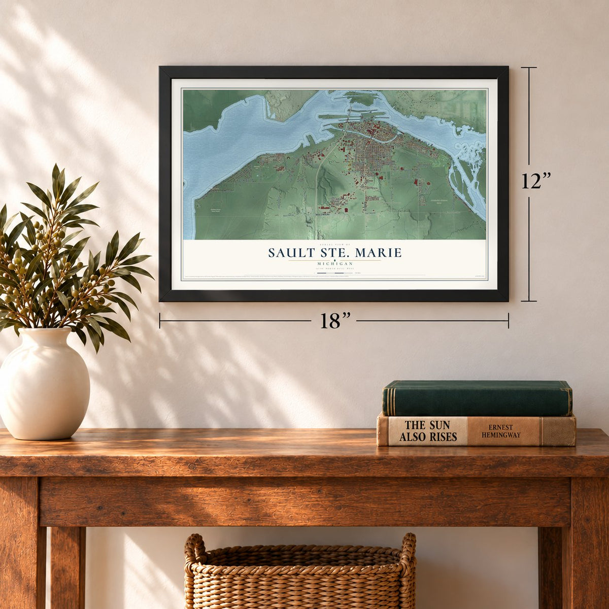 Sault Ste. Marie, Michigan map, 12 x 18 inch print in a black frame in an entryway