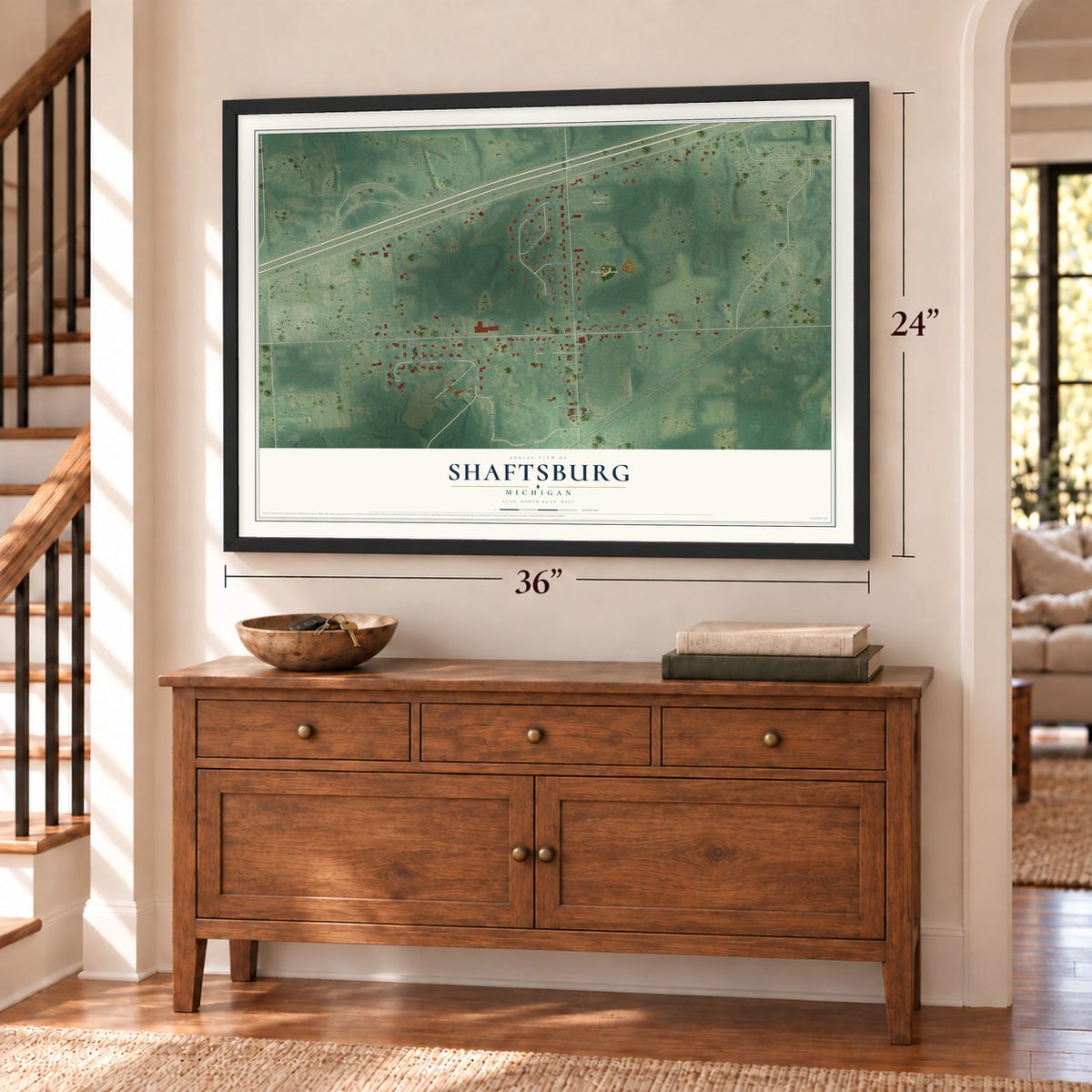 Shaftsburg, Michigan map, 24 x 36 inch print in a black frame above a dresser by a staircase