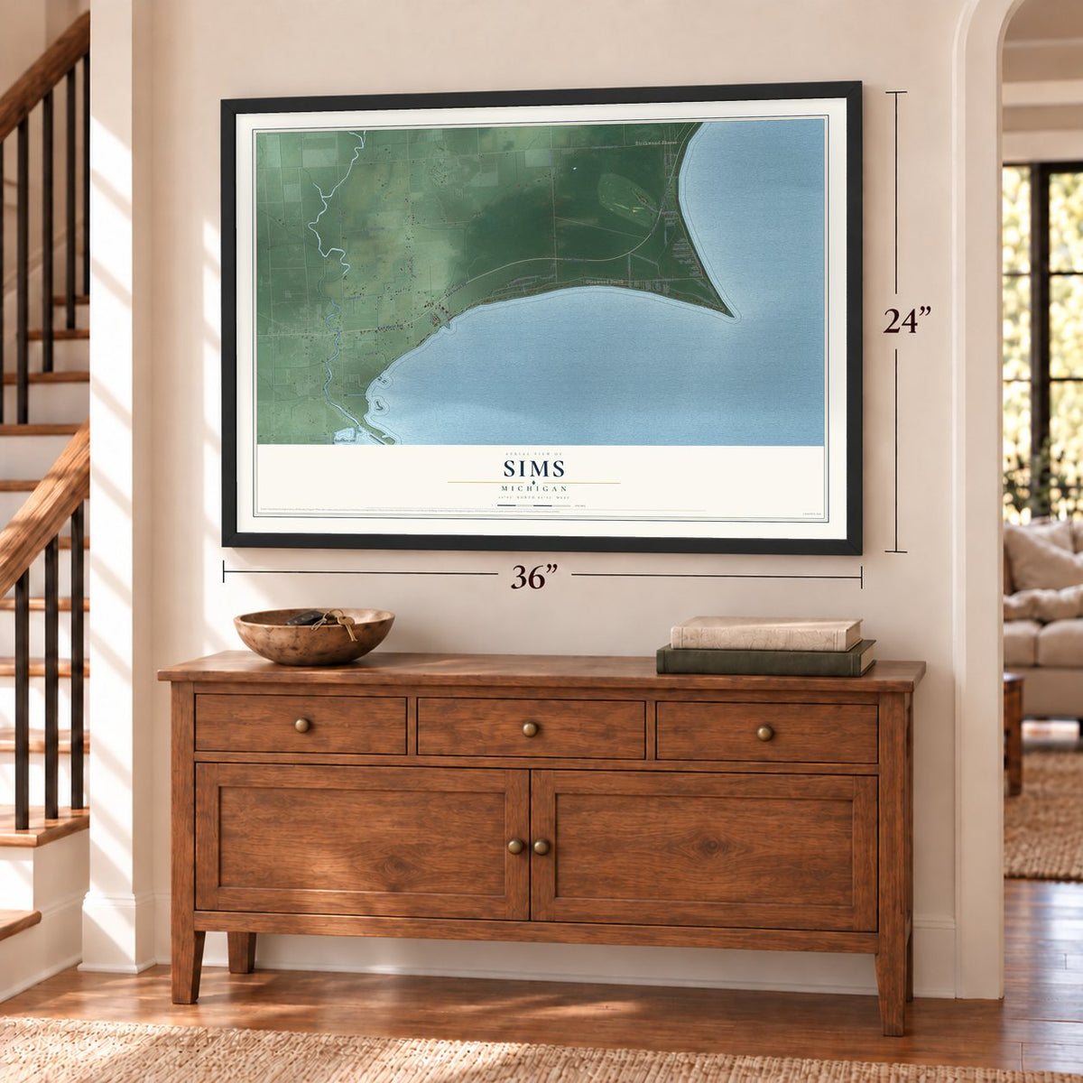 Sims, Michigan map, 24 x 36 inch print in a black frame above a dresser by a staircase