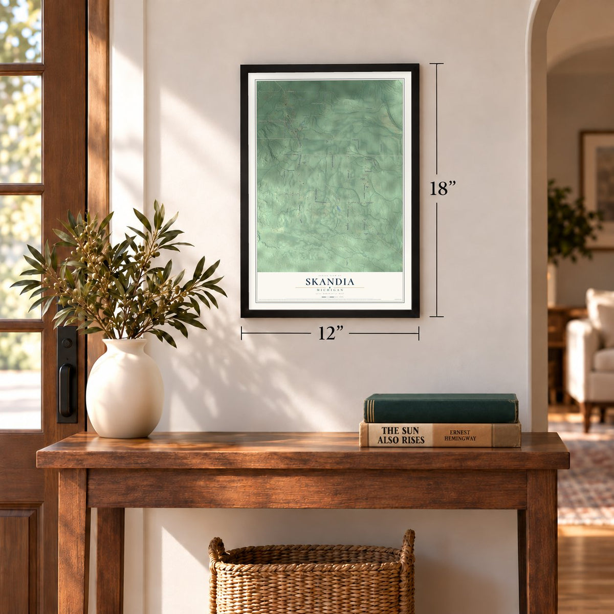 Skandia, Michigan map, 12 x 18 inch print in a black frame in an entryway