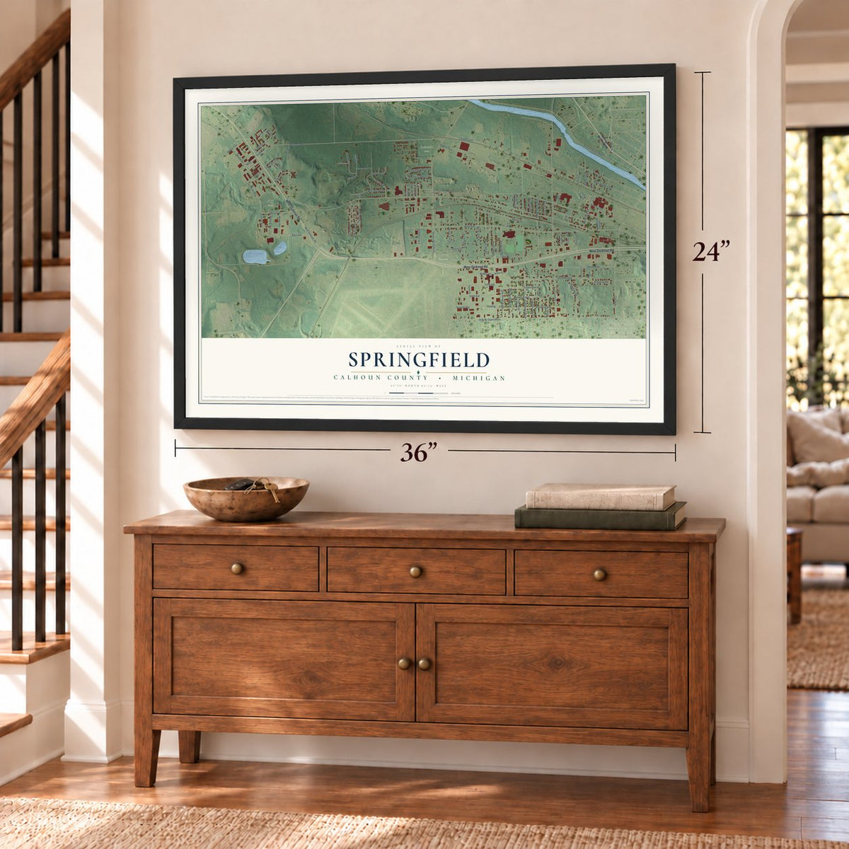 Springfield, Calhoun County, Michigan map, 24 x 36 inch print in a black frame above a dresser by a staircase