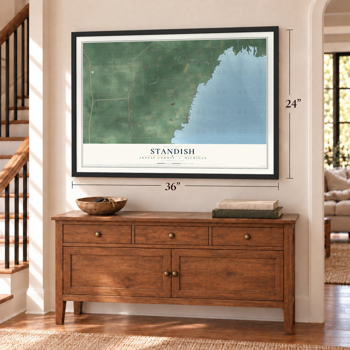Standish, Arenac County, Michigan map, 24 x 36 inch print in a black frame above a dresser by a staircase