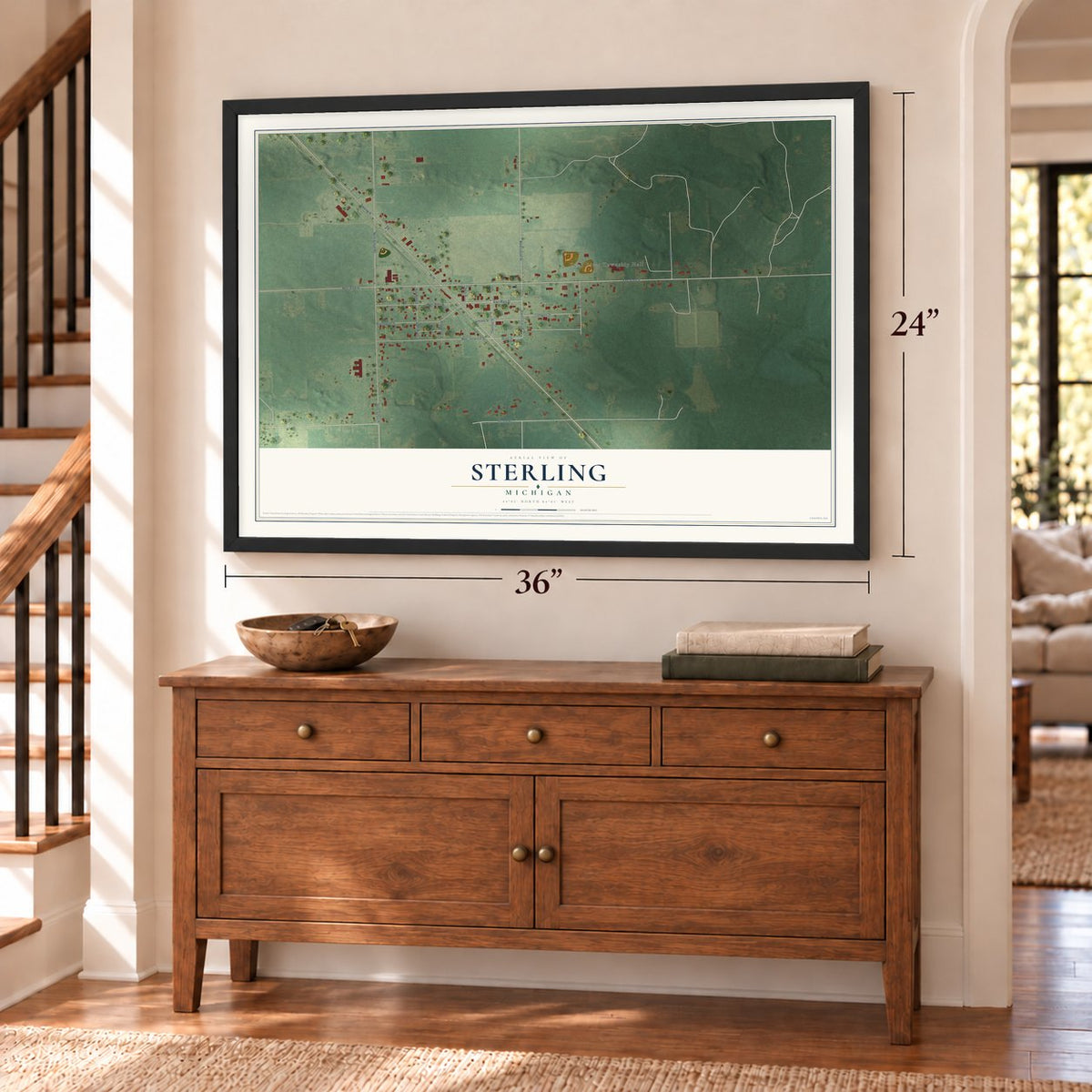 Sterling, Michigan map, 24 x 36 inch print in a black frame above a dresser by a staircase