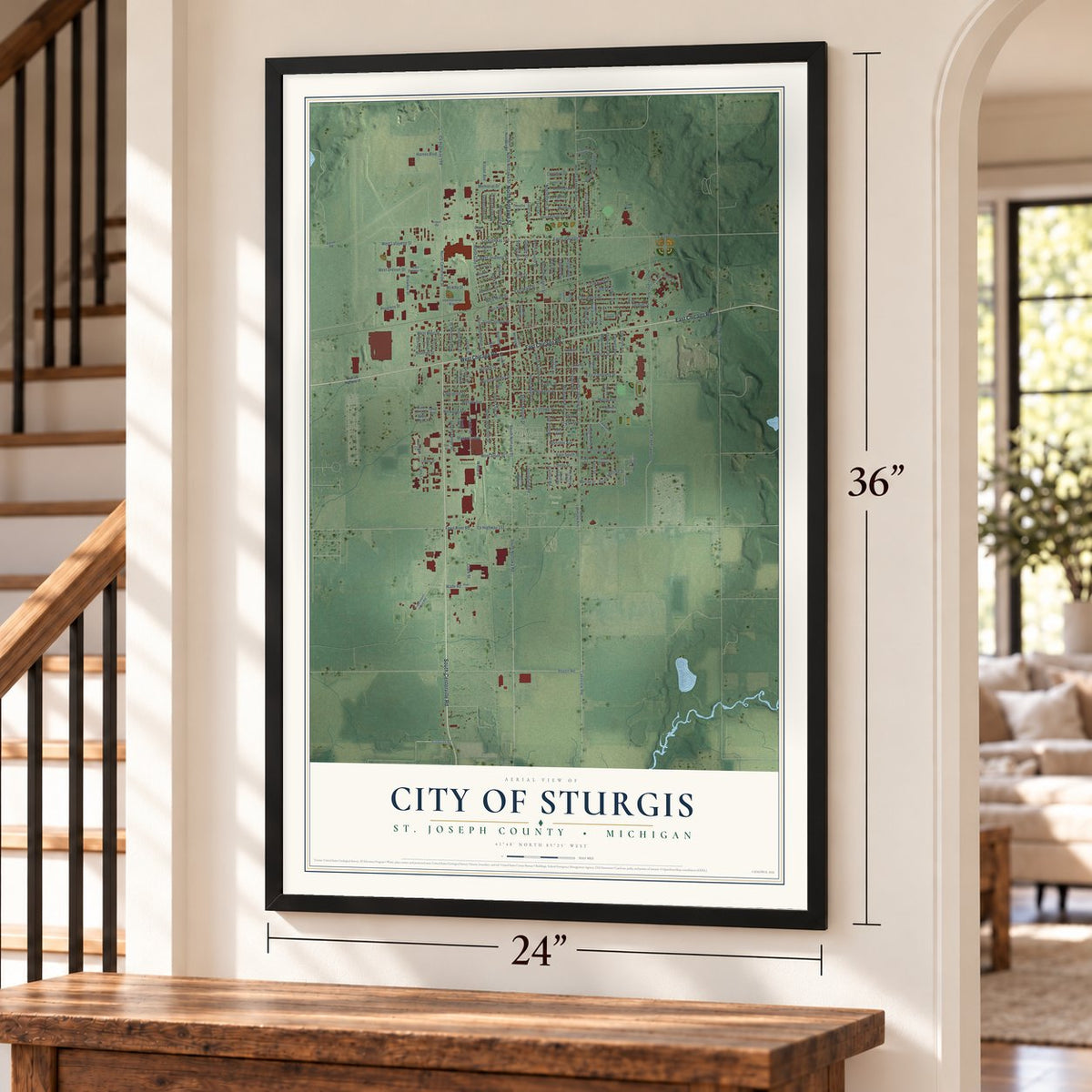 Sturgis, Michigan map, 24 x 36 inch print in a black frame by a staircase