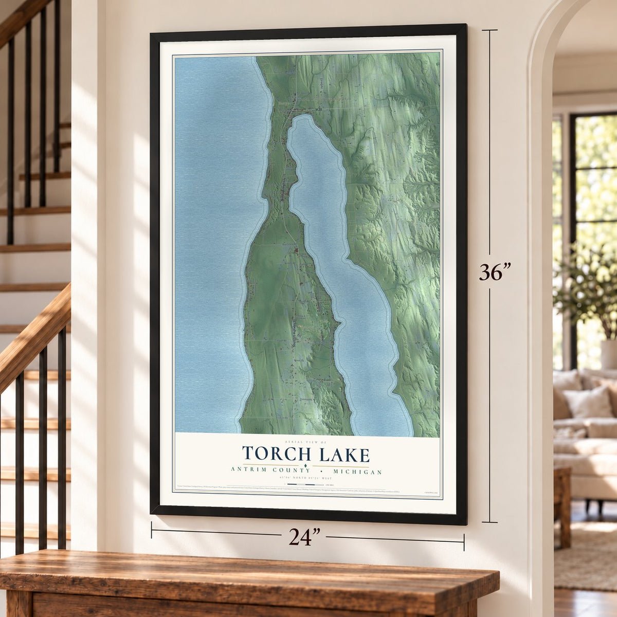 Torch Lake, Antrim County, Michigan map, 24 x 36 inch print in a black frame by a staircase