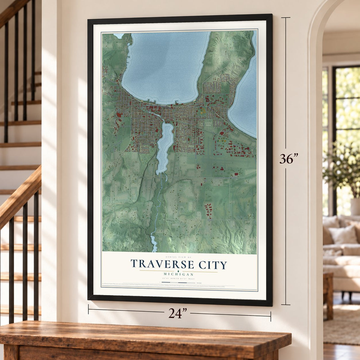Traverse City, Michigan map, 24 x 36 inch print in a black frame by a staircase