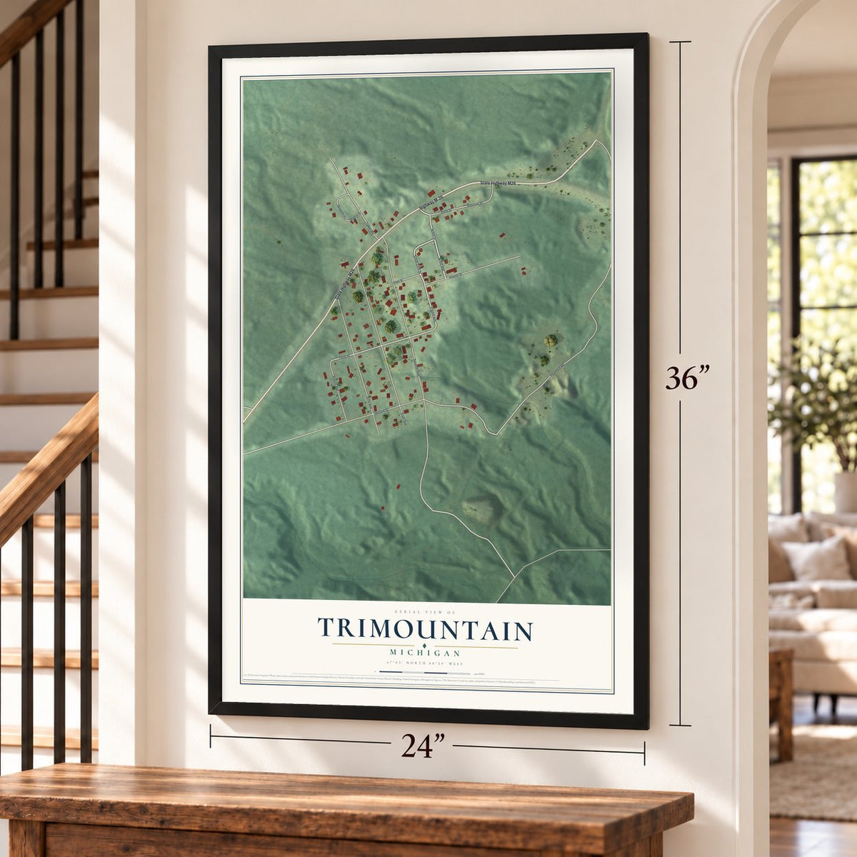 Trimountain, Michigan map, 24 x 36 inch print in a black frame by a staircase