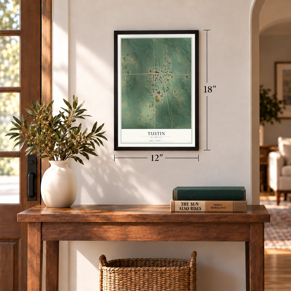 Tustin, Michigan map, 12 x 18 inch print in a black frame in an entryway