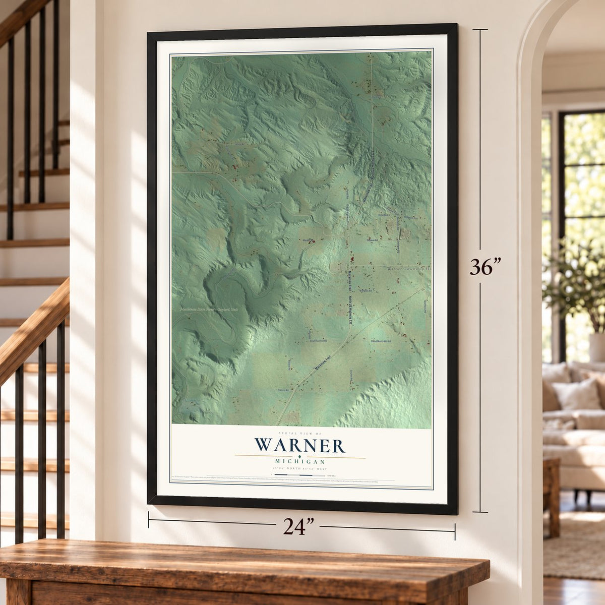 Warner, Michigan map, 24 x 36 inch print in a black frame by a staircase
