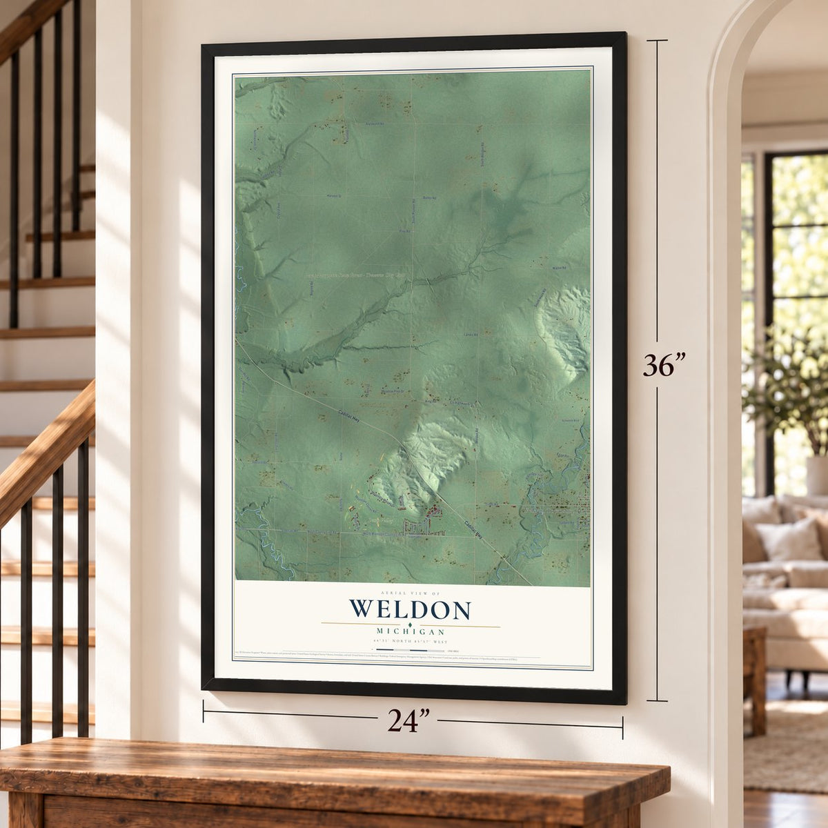 Weldon, Michigan map, 24 x 36 inch print in a black frame by a staircase