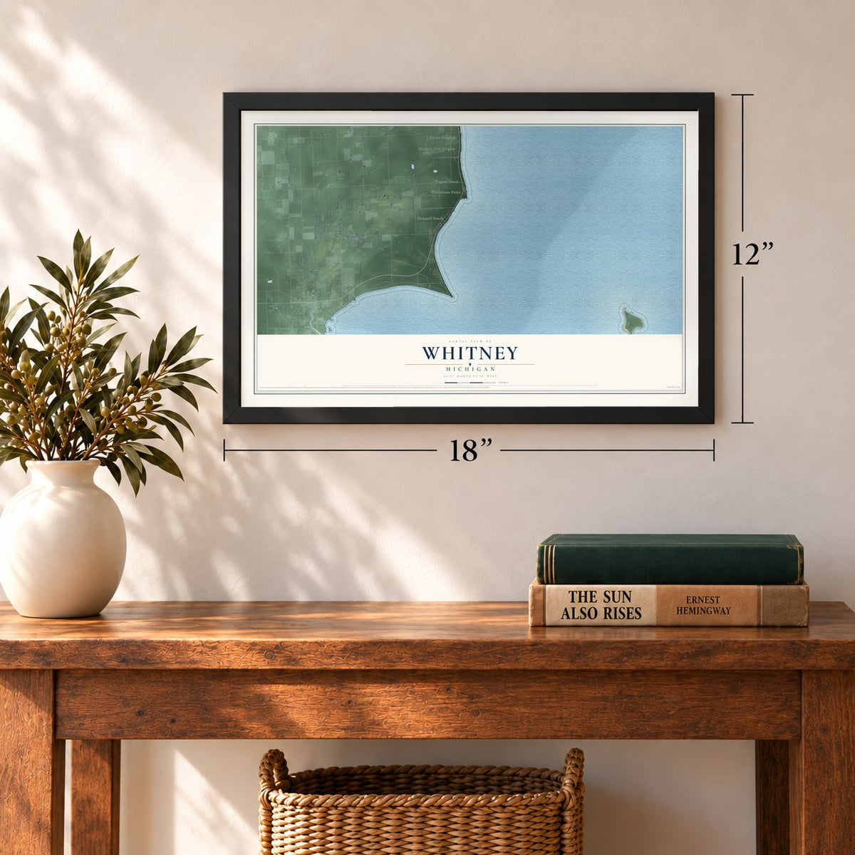 Whitney, Michigan map, 12 x 18 inch print in a black frame in an entryway