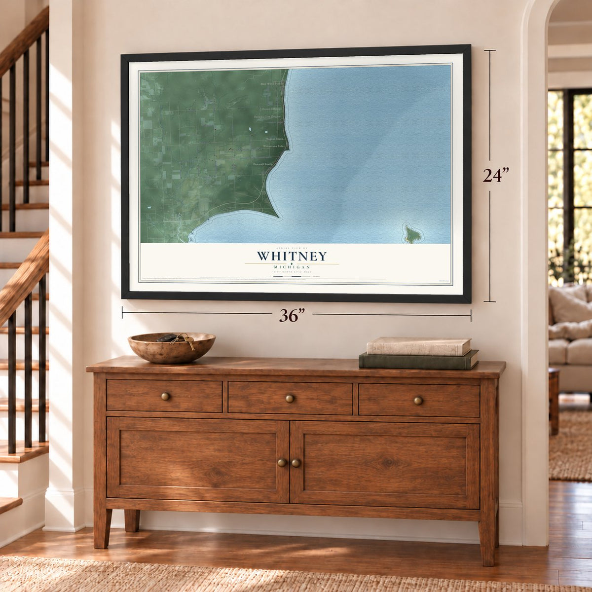 Whitney, Michigan map, 24 x 36 inch print in a black frame above a dresser by a staircase