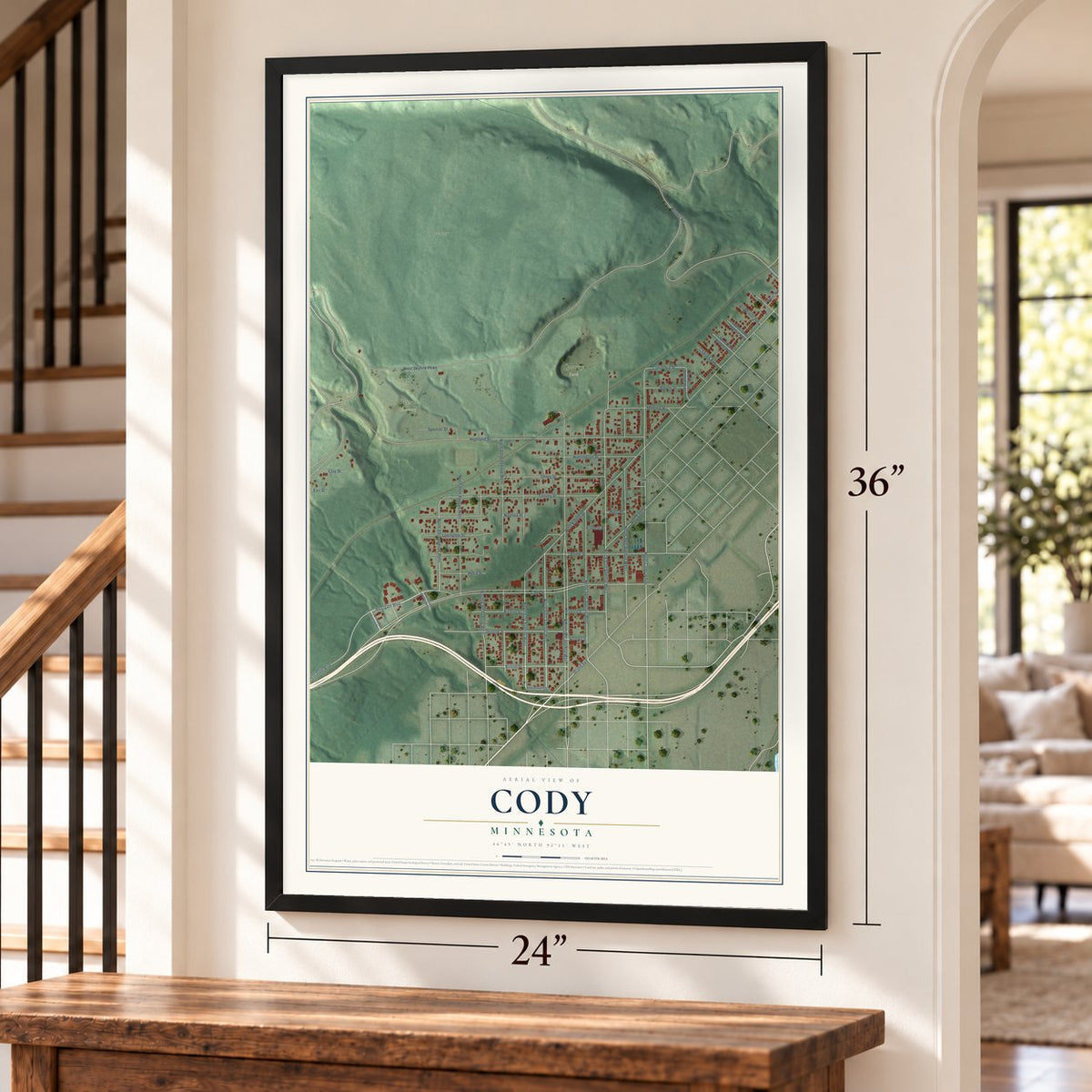 Cody, Minnesota map, 24 x 36 inch print in a black frame by a staircase