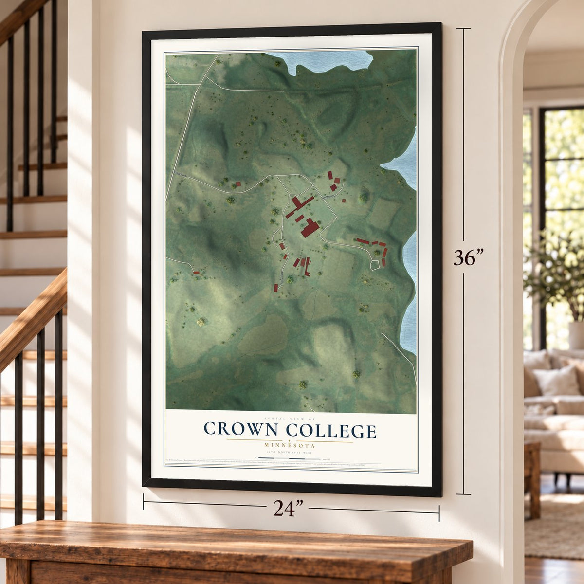 Crown College, Minnesota map, 24 x 36 inch print in a black frame by a staircase
